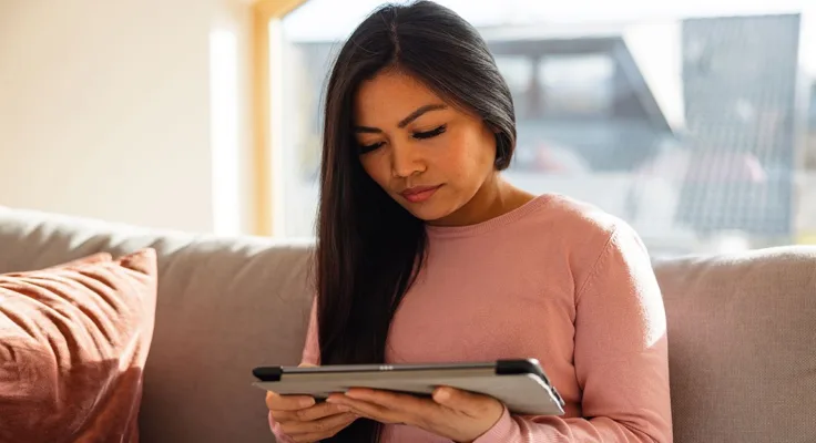Female reading tablet
