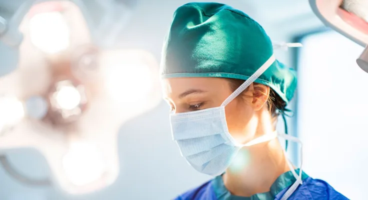 OR nurse standing in the operating room.