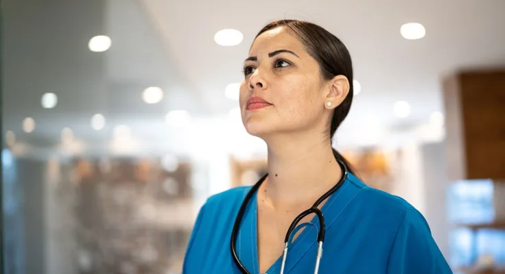 Female nurse using critical thinking in her nursing role