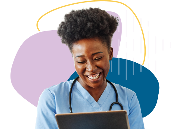 Nurse in blue scrubs smiling at tablet