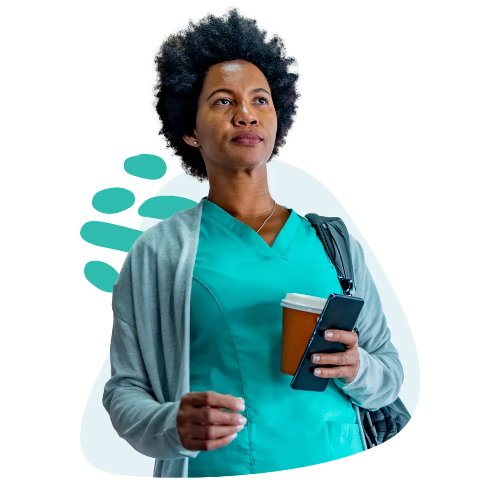 Nursing student on her way to class with coffee in her hand