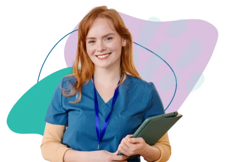 Nurse educator holding iPad preparing to teach nursing students.