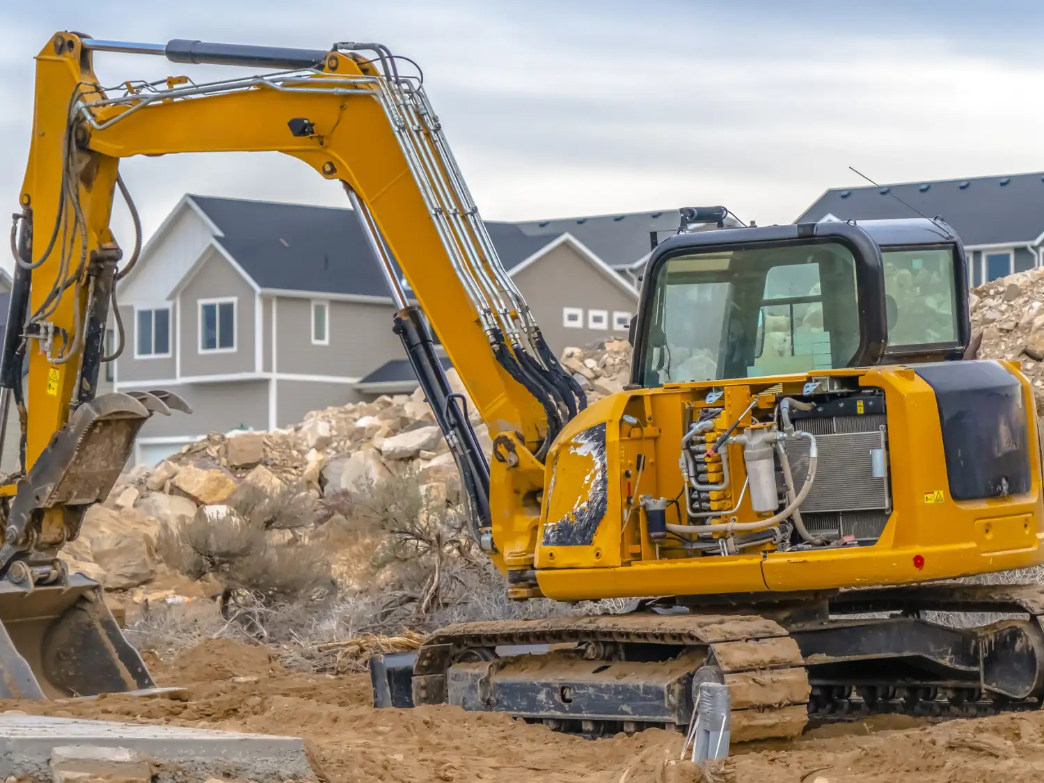 housing starts excavator breaking ground