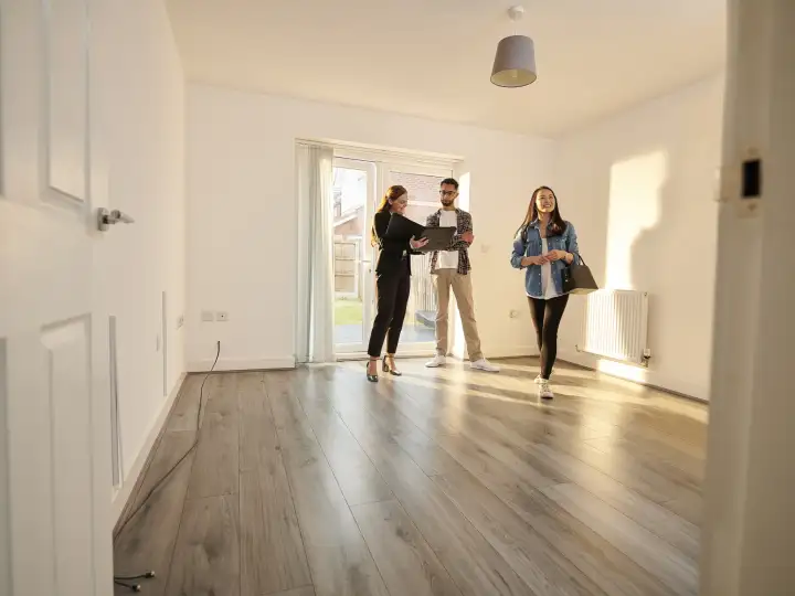 First-time homebuyers touring a home.