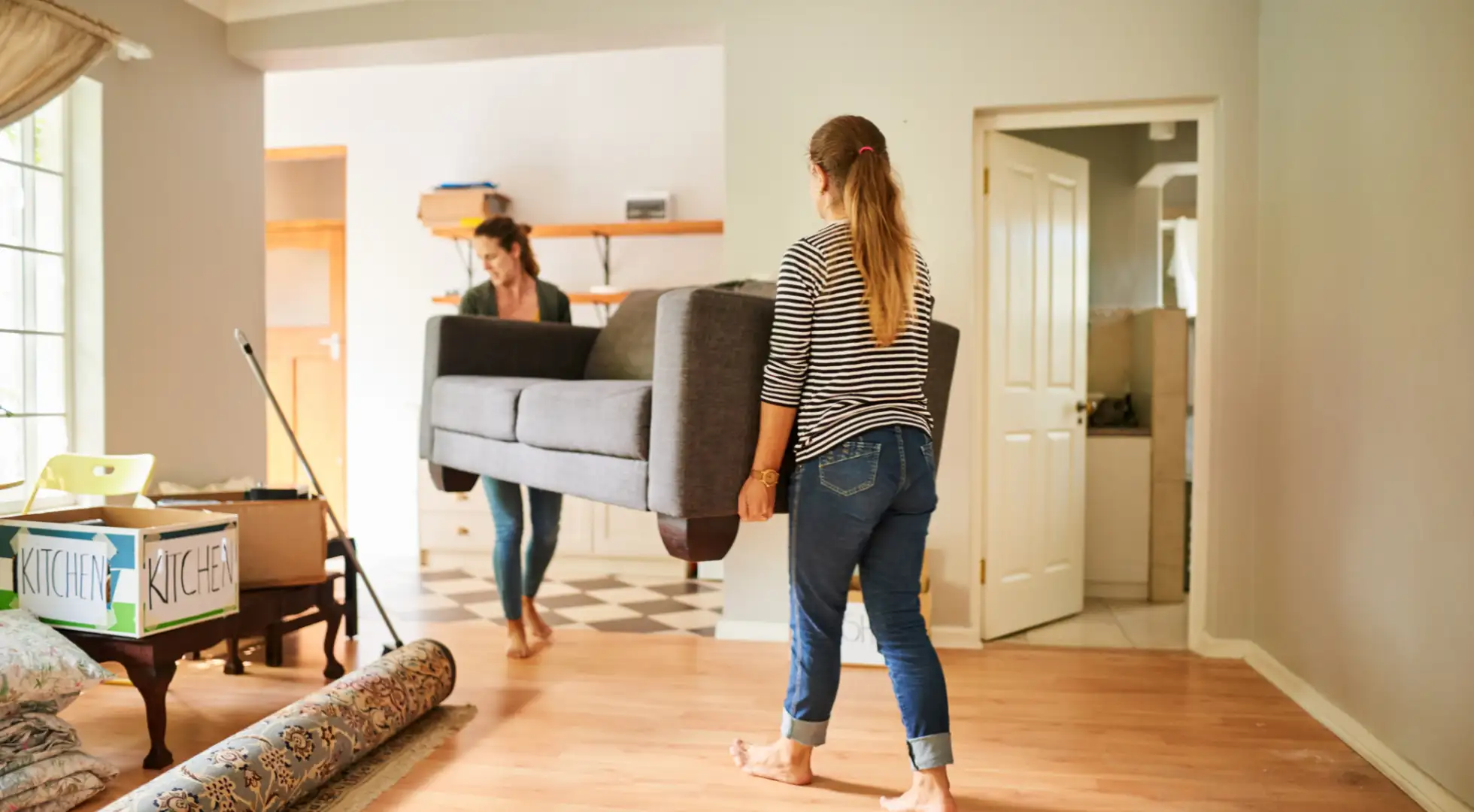 Roommates move into their new home.