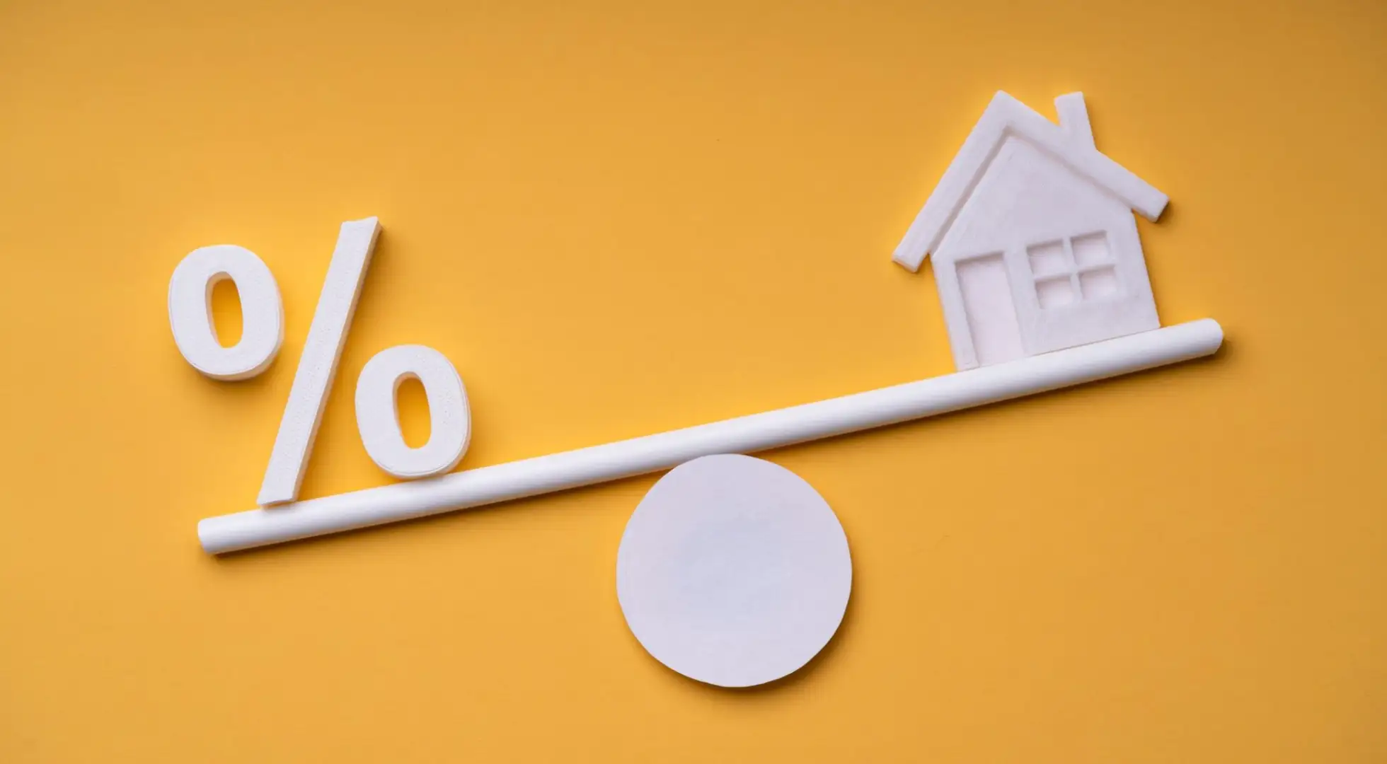 What Percent of Your Income Should Go Towards Your Mortgage? Percent sign on a balance with a home
