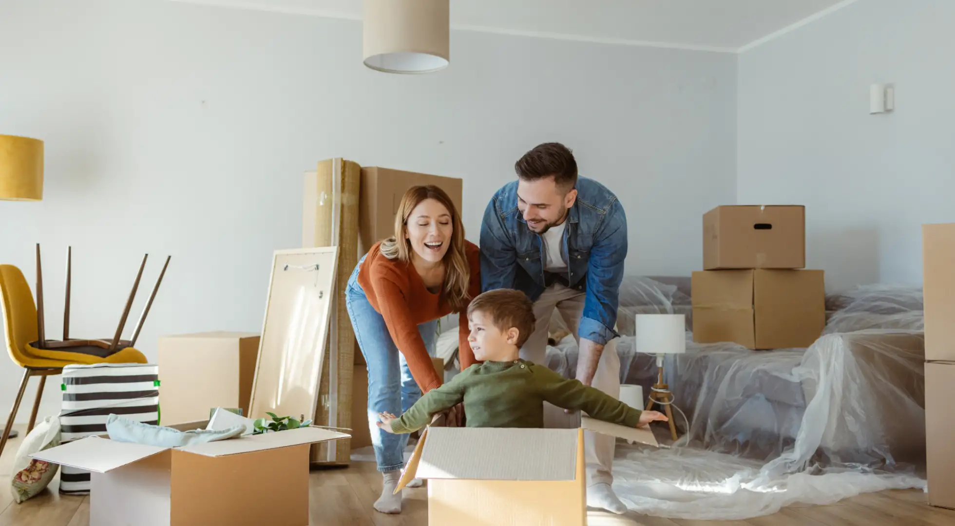 Buying in a Seller’s Market vs. Buyer’s Market: How to Adapt Your Strategy Family playing together while packing up house