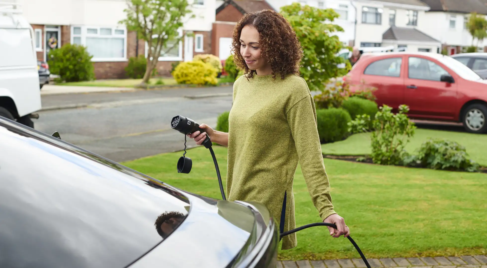 Woman charging EV