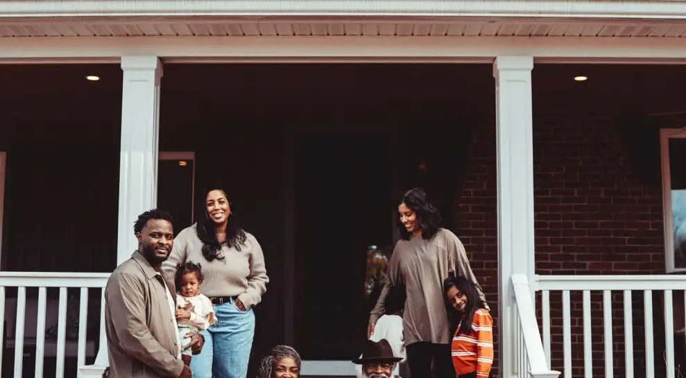 Multigenerational family in front of their home