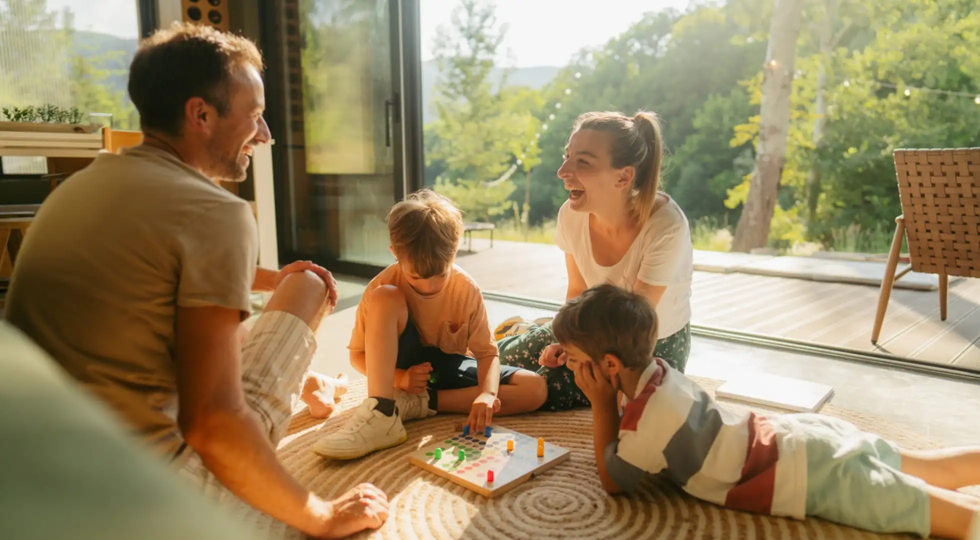 A family plays games in their home during springtime