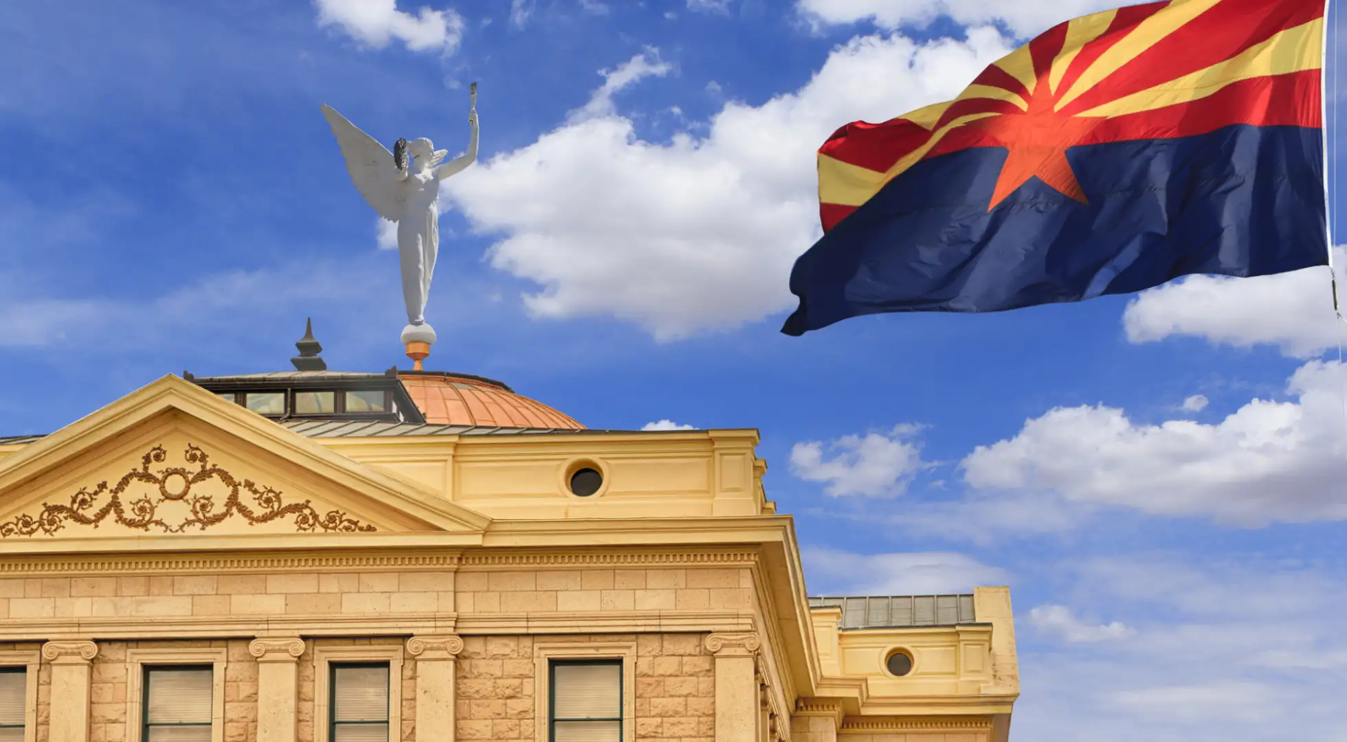 state flag of arizona flying in front of the arizona capitol building: down payment assistance