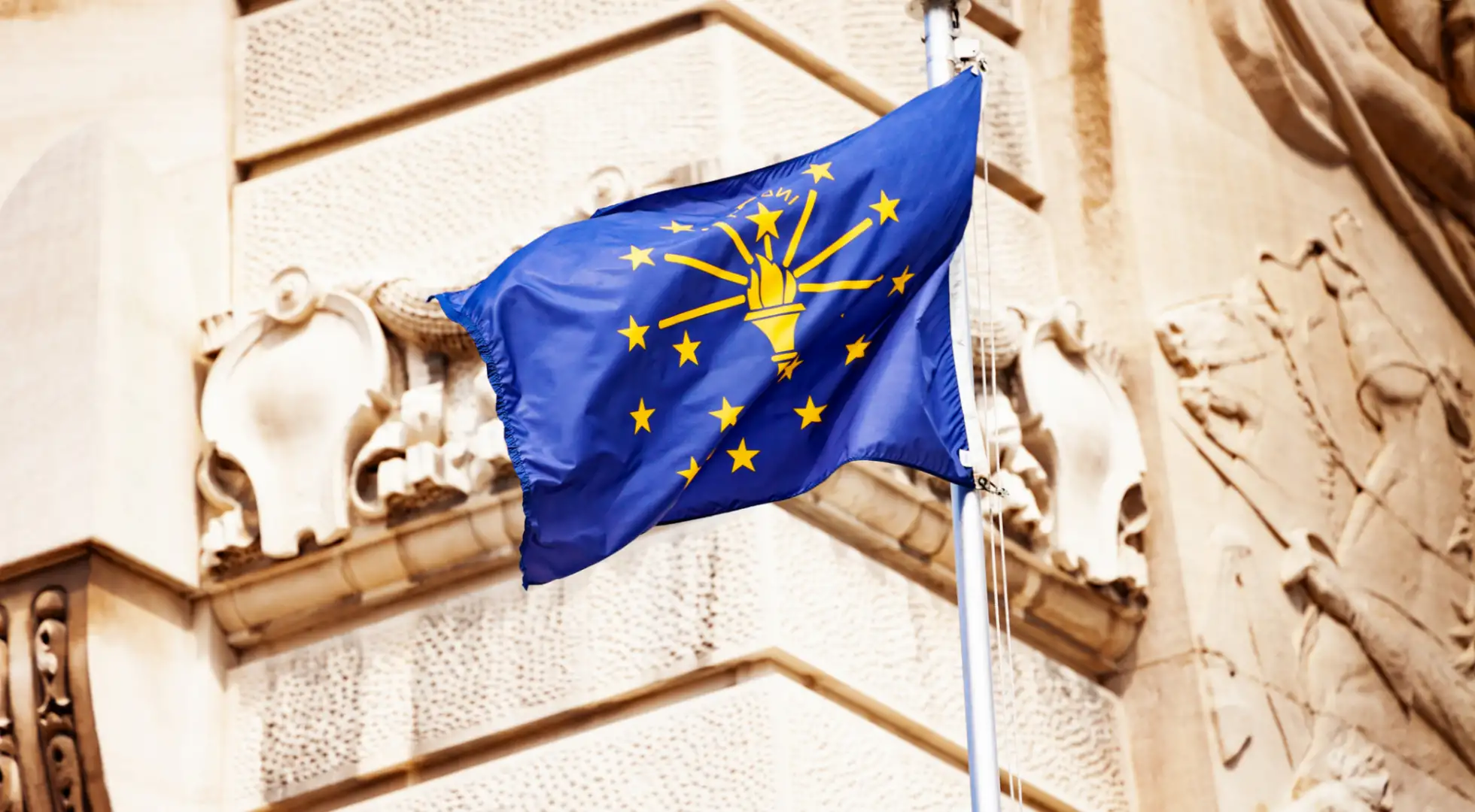 indiana state flag in front of soldiers and sailors monument in indianapolis: down payment assistance