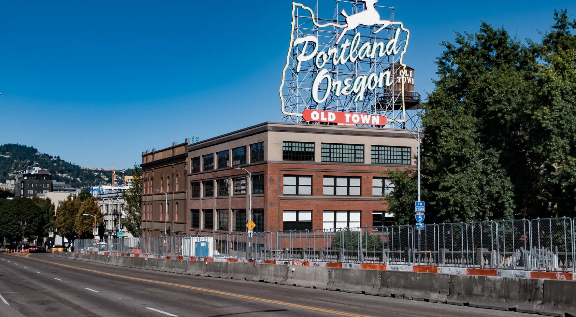 white stag sign atop the white stag building in portland oregon: down payment assistance