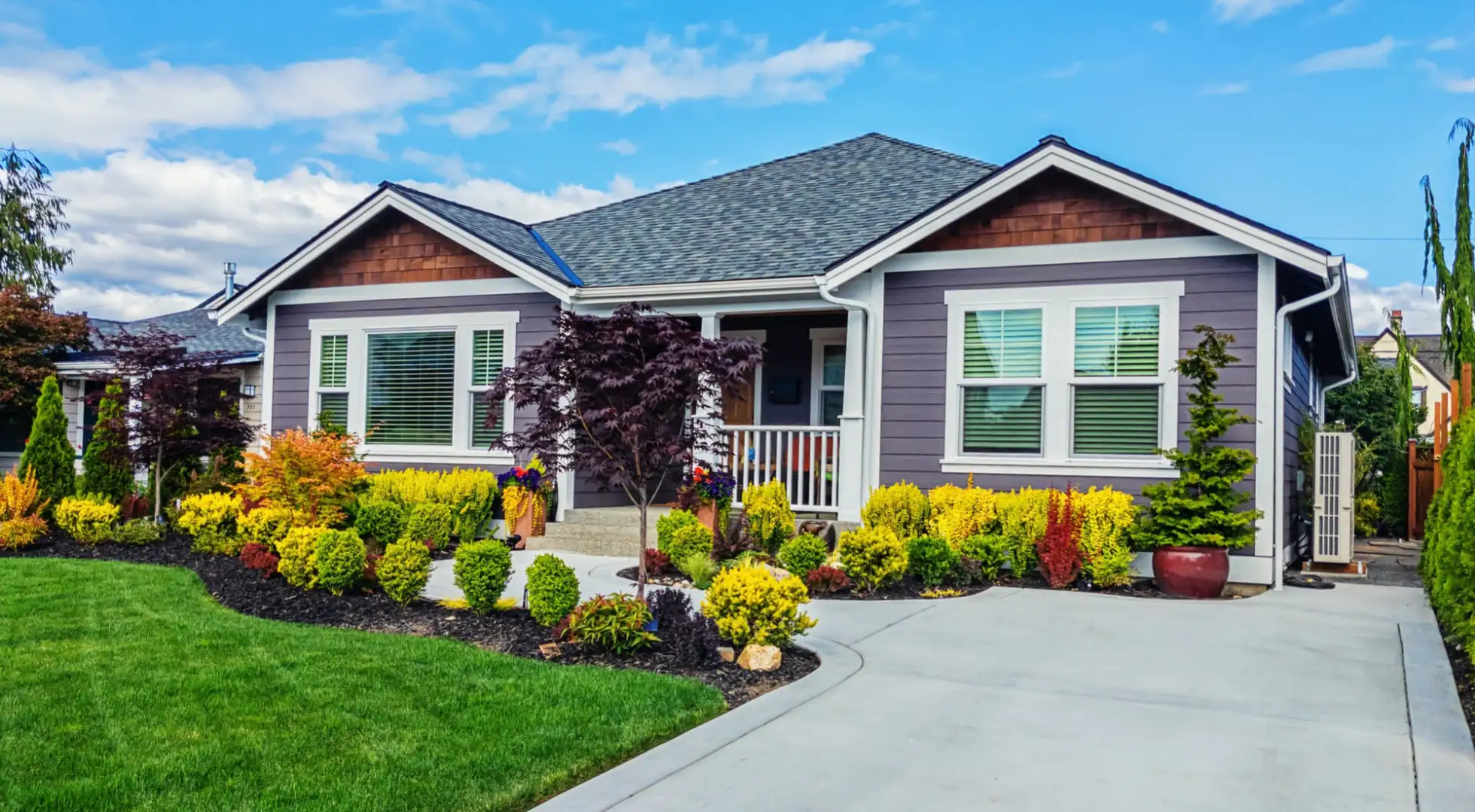 suburban home with a manicured lawn and light purple facade: largest ARM lenders