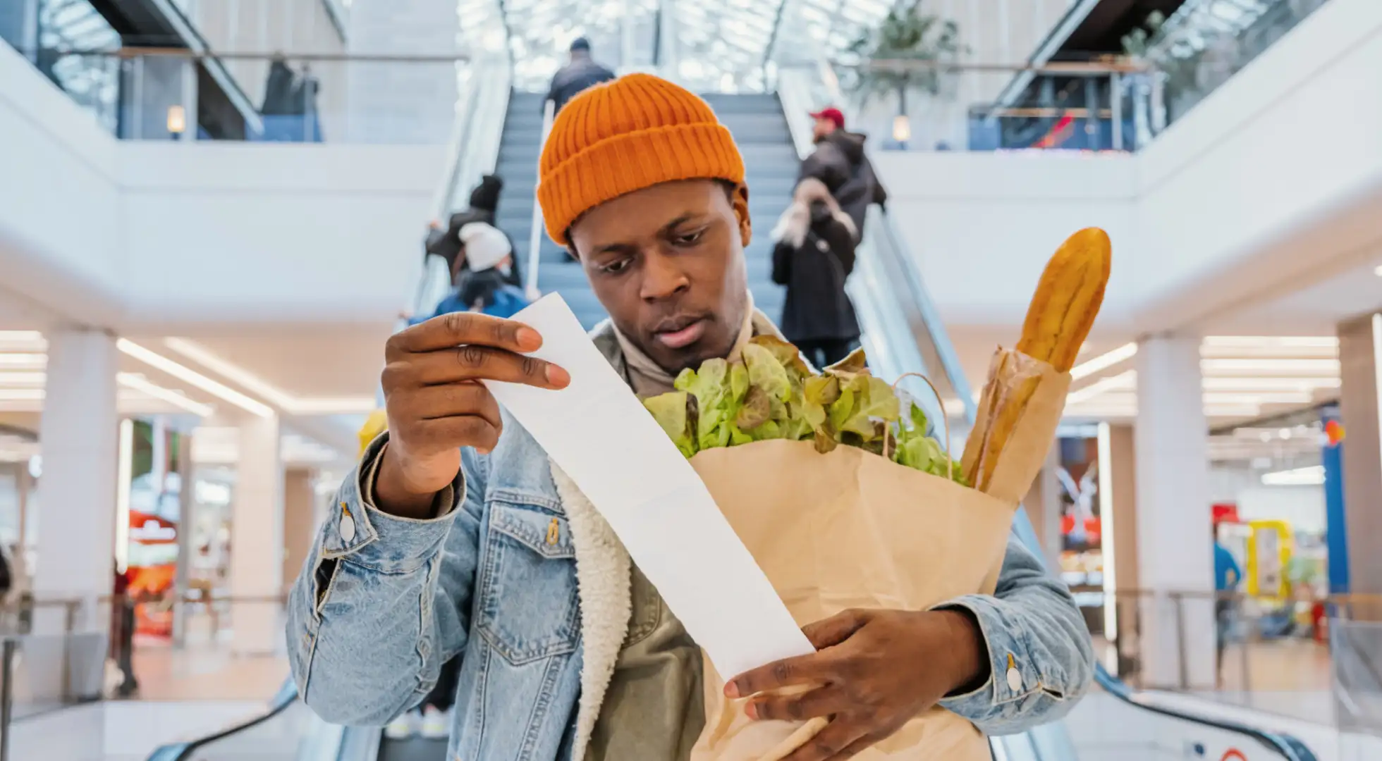 consumer looking at grocery receipt