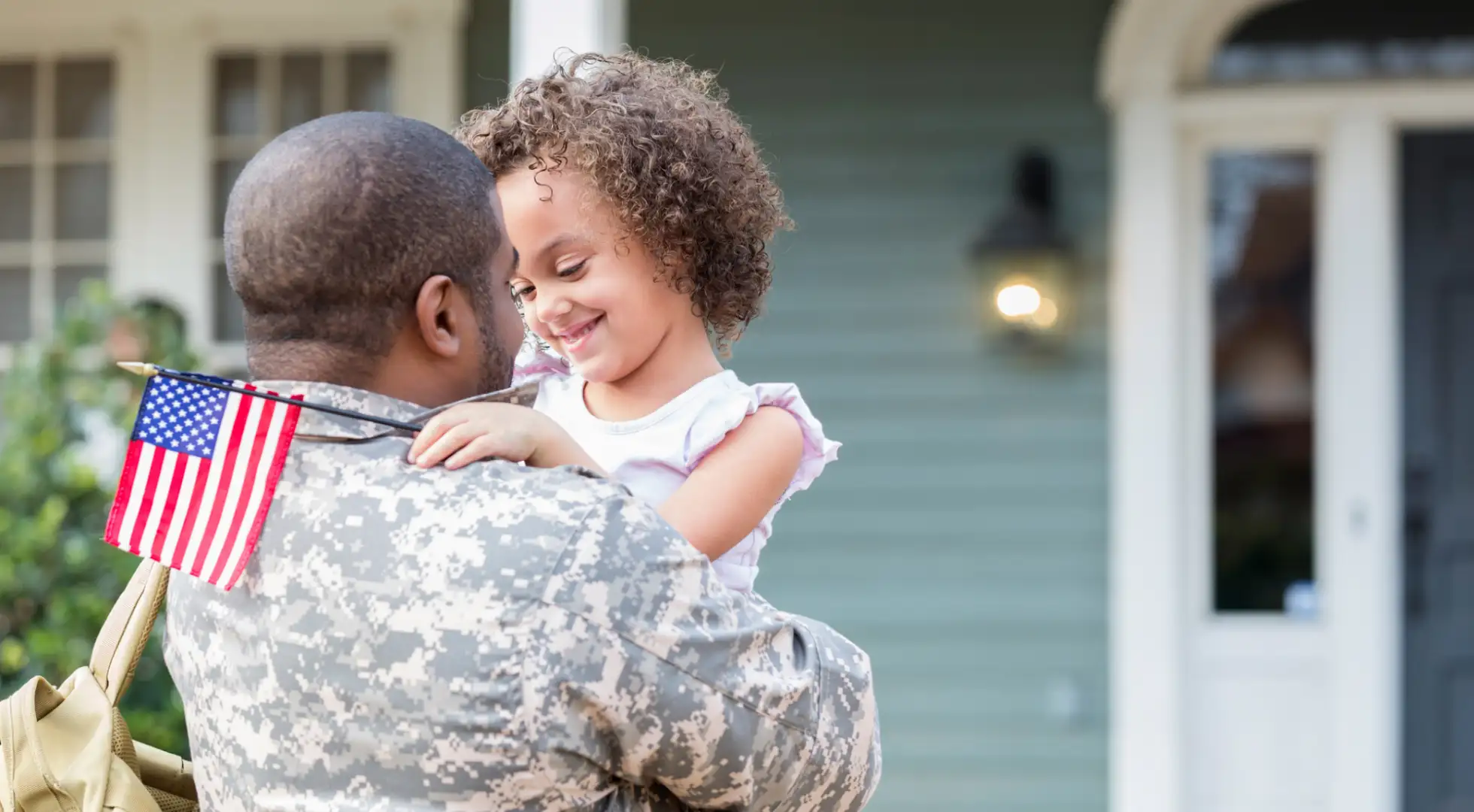 Soldier with kid in front of house: mortgage rates today