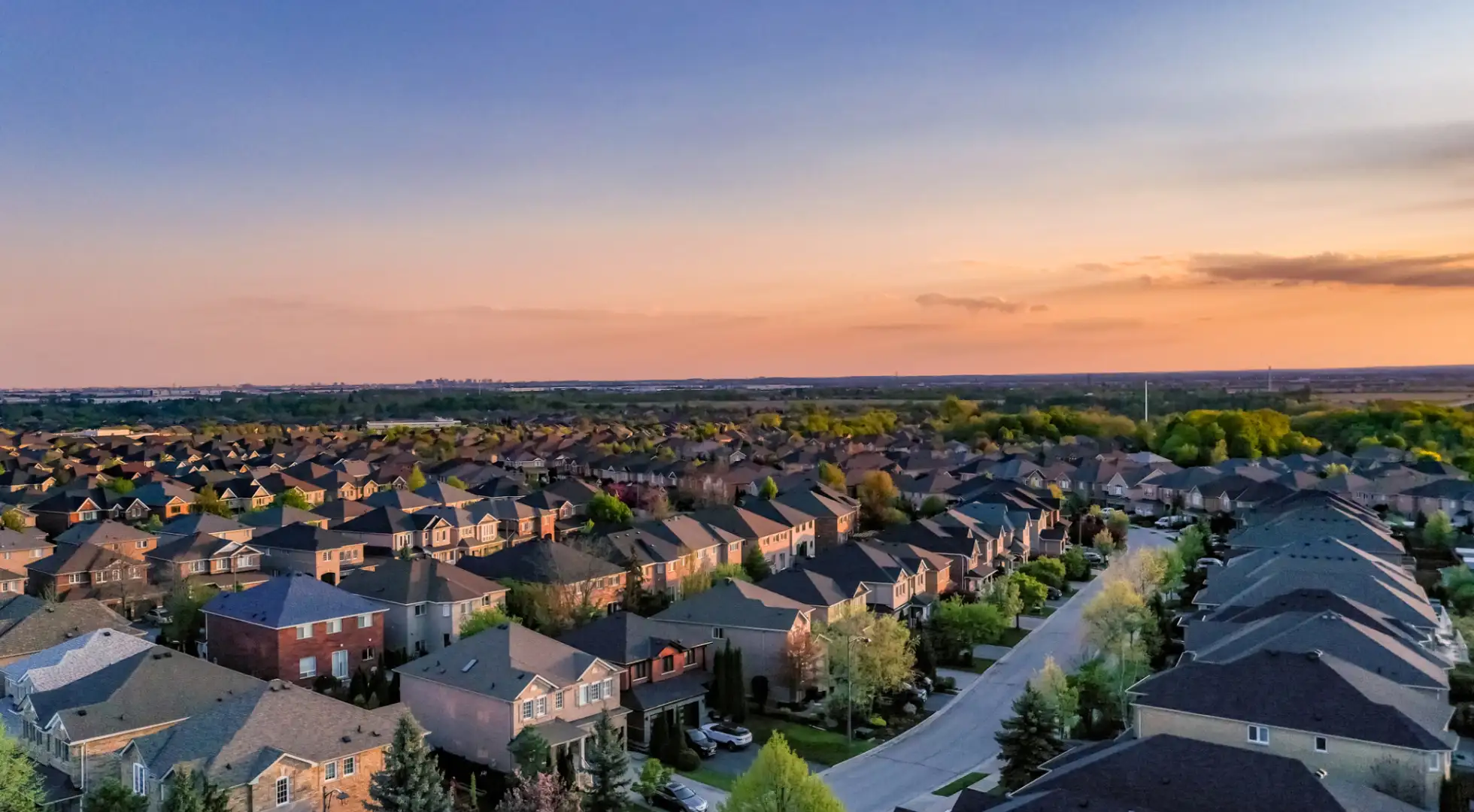 aerial view of neighborhood at sunset