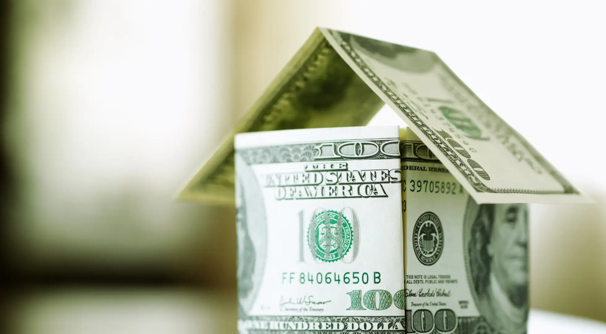 Model house made of dollar bills: mortgage rates today