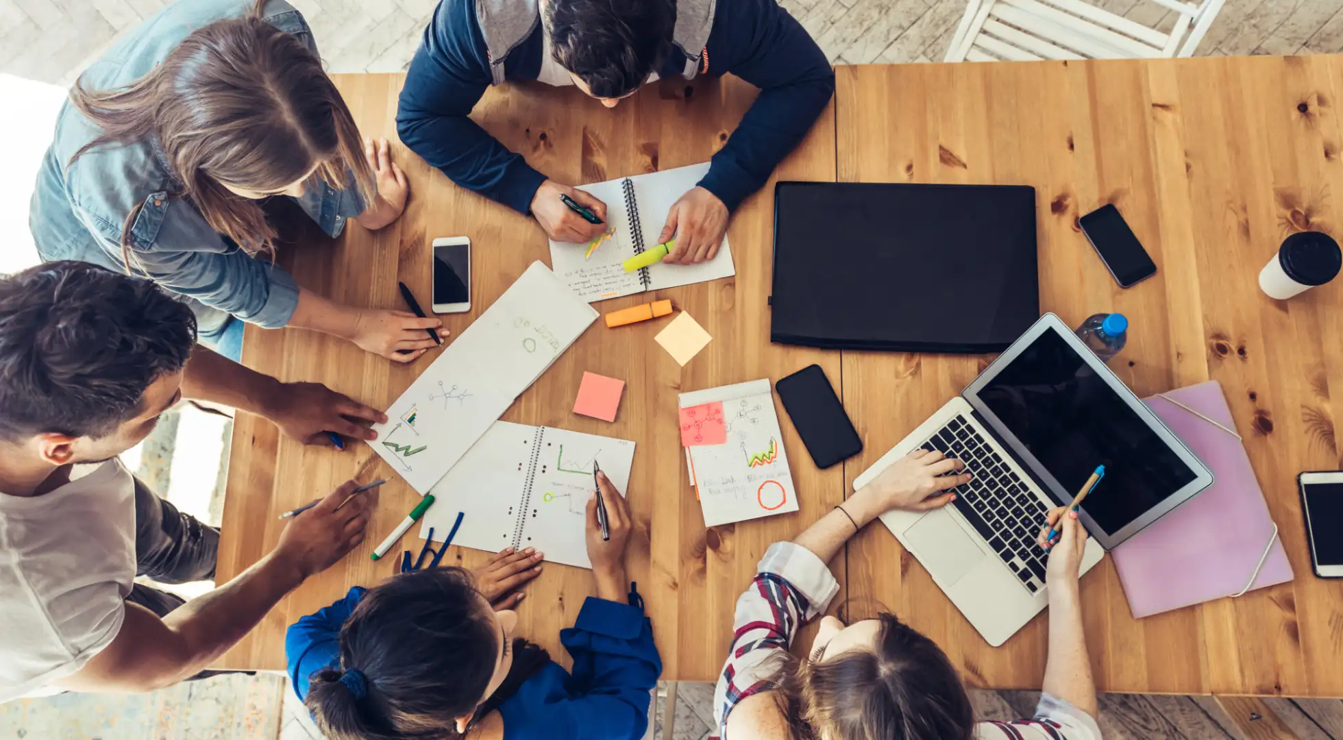 company employees gather in conference room