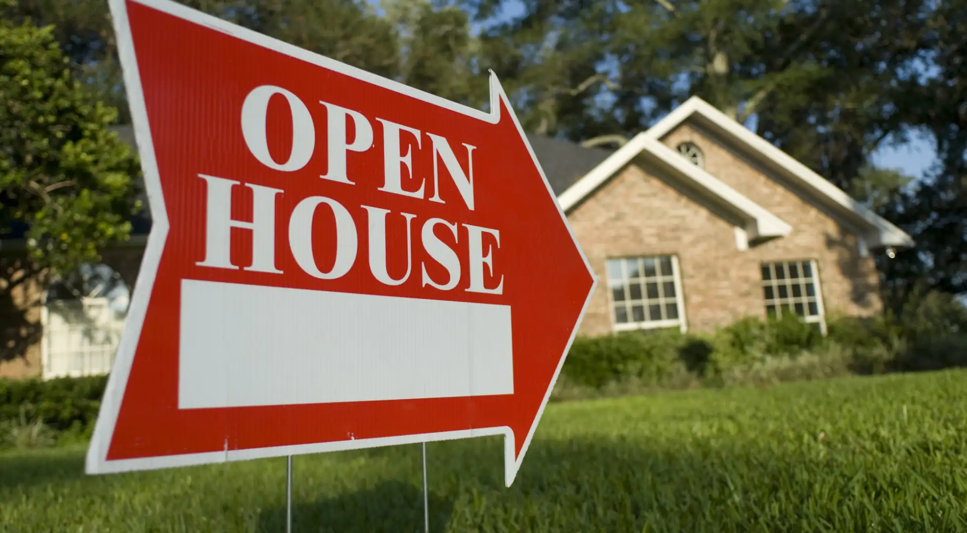 open house sign in front of property