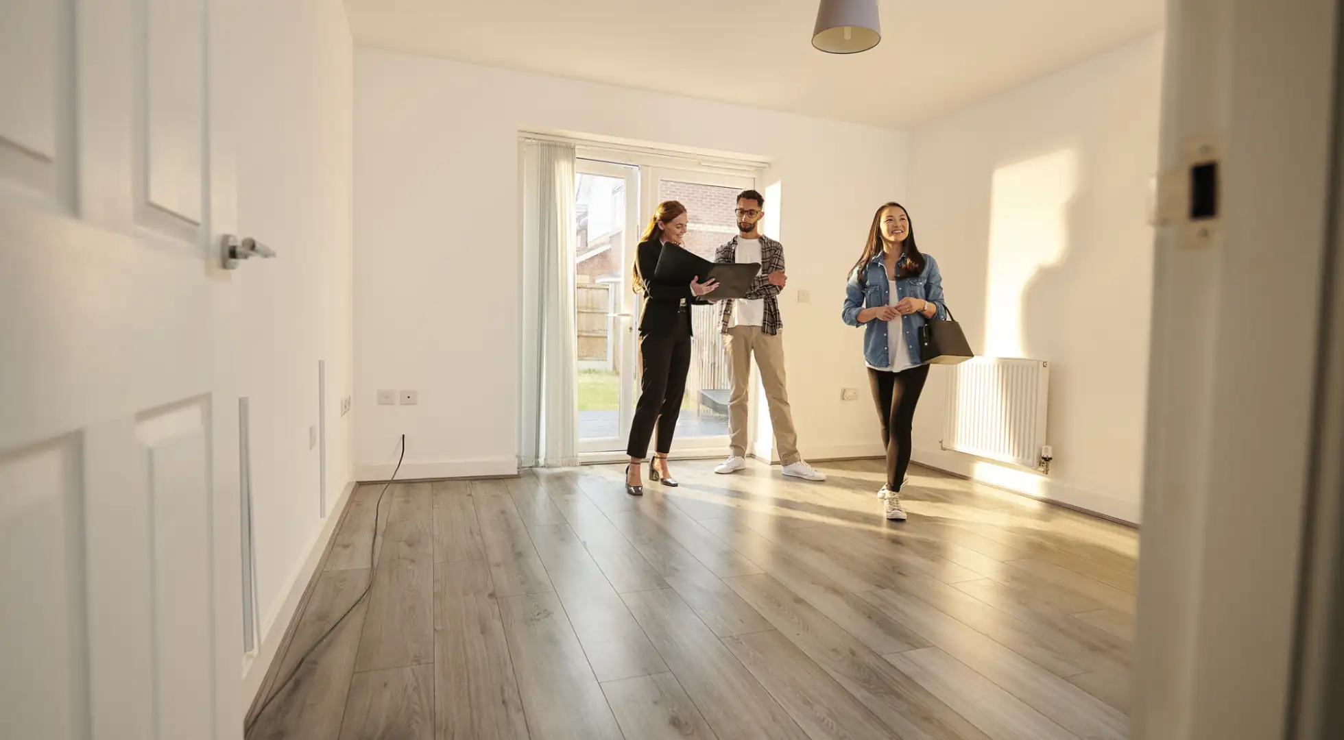 First-time homebuyers touring a home.