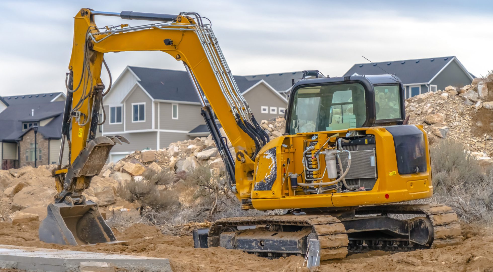 housing starts excavator breaking ground