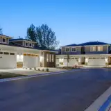 Modern multiunit properties with stone accents in a suburban setting.