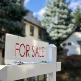 For sale sign in front of a house