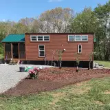Billy Poole says his 560-square-foot tiny home cost $92,000 to build and deliver.