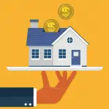 graphic of a hand holding a home with coins above it: down payment assistance