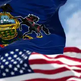 Pennysylvania flag in front of the United States Flag