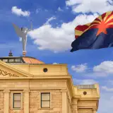 state flag of arizona flying in front of the arizona capitol building: down payment assistance