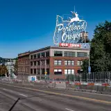 white stag sign atop the white stag building in portland oregon: down payment assistance