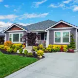 suburban home with a manicured lawn and light purple facade: largest ARM lenders