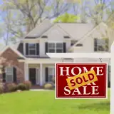 Home with sold sign