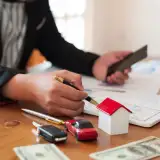 homebuyer at a desk looking over their credit report