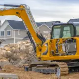 housing starts excavator breaking ground