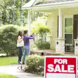 potential buyers taking picture of home for sale