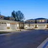 Modern multiunit properties with stone accents in a suburban setting.