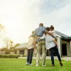 A family celebrating the purchase of their new home using Freddie Mac's Home Possible mortgage program.