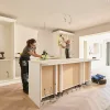 Workers completing a kitchen renovation