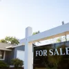 FHA Loan Affordability: How Much House Do You Qualify For? For sale sign in front of a house
