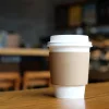 What Gives Pumpkin Spice Latte Prices The Right To Rise Faster Than Home Prices? It’s a Travesty Coffee cup on a table.