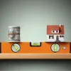Wad of money and a home on a construction level, representing home construction loans