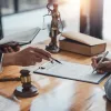 An attorney pointing to paperwork