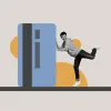 A man pushes a large credit card