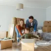 Family playing together while packing up house