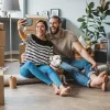 couple taking a photo in their new phone: buying a home you can keep