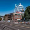 white stag sign atop the white stag building in portland oregon: down payment assistance