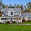 A nice home with a porch and green lawn